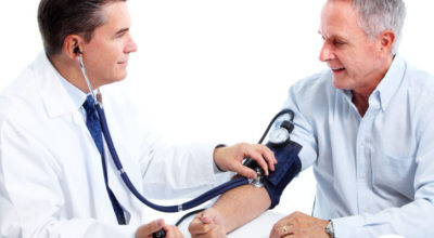 Doctor measuring blood pressure.